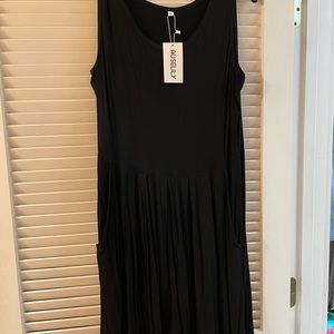 Pull over black knit dress with pockets.  Very comfy!